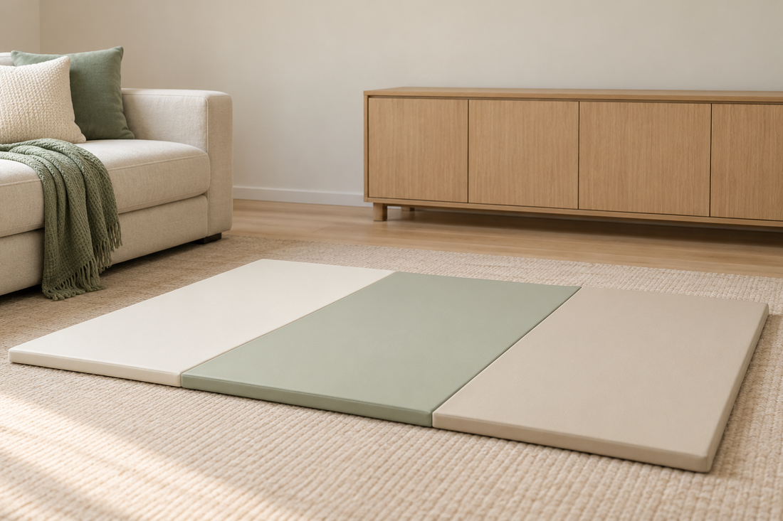 A tidy floor-level play area, a stable low cabinet and closed storage in a bright living room.