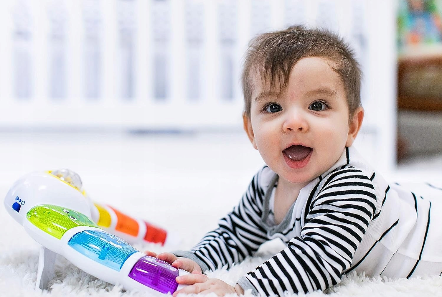 BABY EINSTEIN panel świetlny z grzechotką, melodiami i słowami w 3 językach
