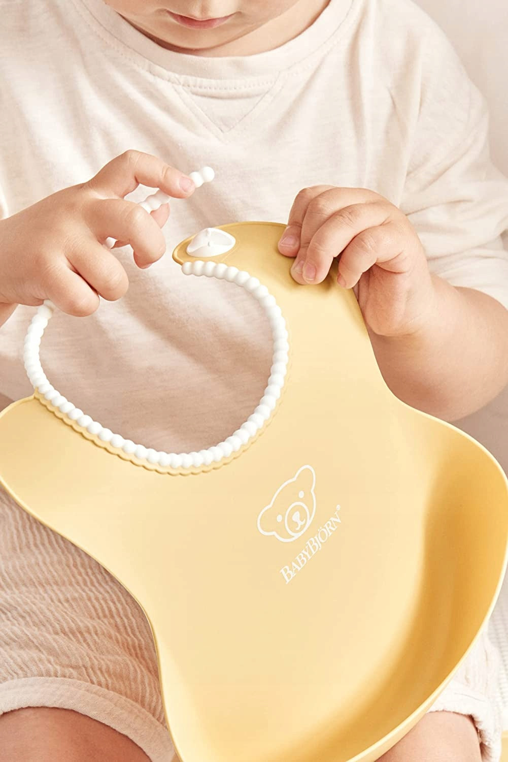 BABYBJORN bavetă din silicon cu buzunar x2
