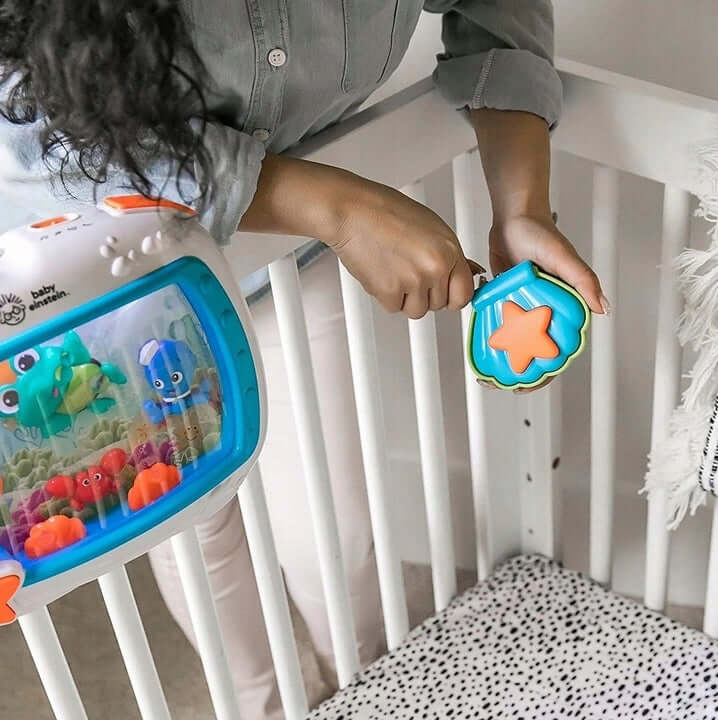 BABY EINSTEIN Morskie Sny POZYTYWKA + PILOT, lampka-pozytywka z pilotem do łóżeczka, 10 melodii i morskie dźwięki