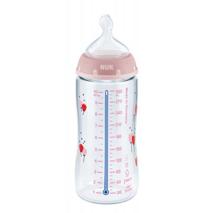 Poglądowe zdjęcie: butelka z różowym pierścieniem, podziałką i pionowym niebieskim paskiem.