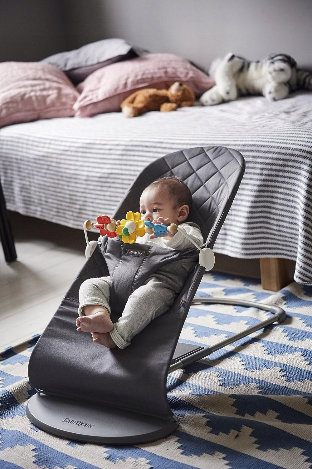 BabyBjorn Flying Friends colors: red, yellow, blue